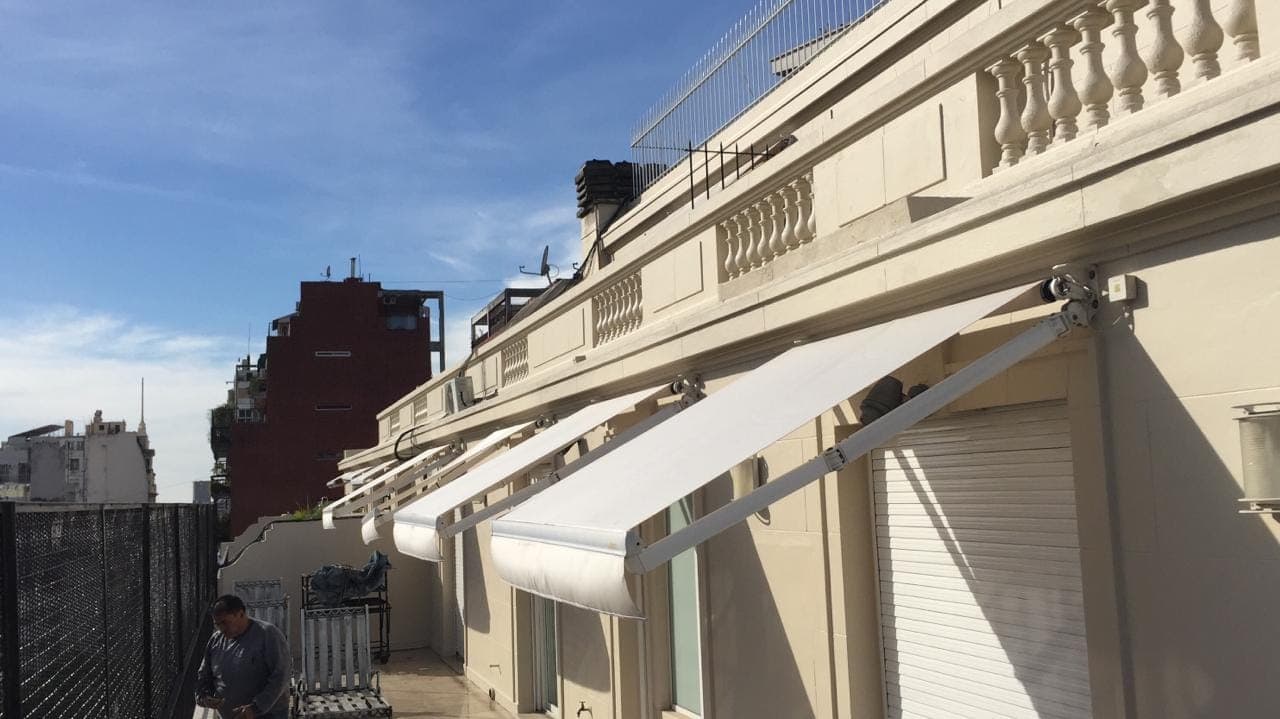 Toldos/toldo brazos invisibles 2 - obra Arenales.jpg